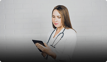 Doctor holding telehealth device